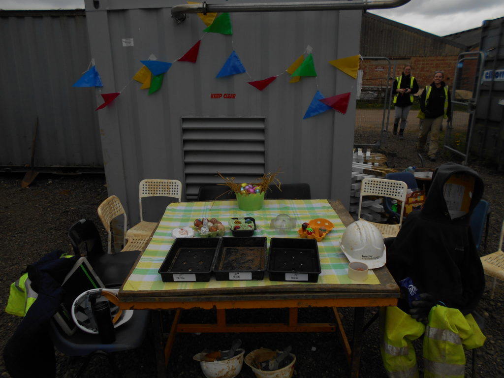 Field Archaeologists race to see who has won the Milton Keynes 2017 Decorated Easter Egg competition at Common Farm.