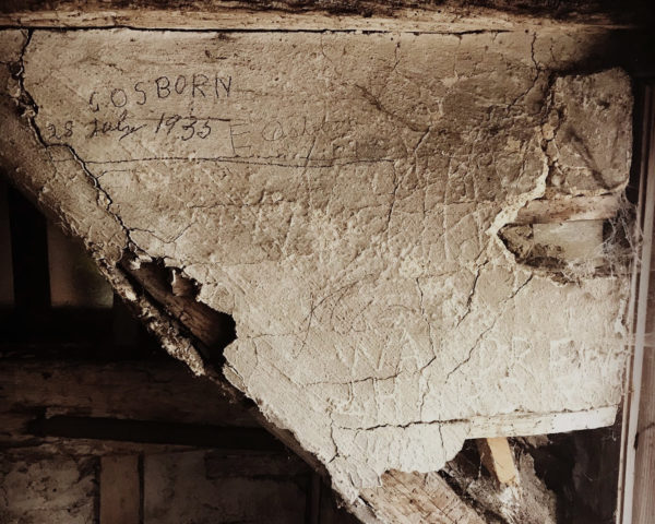 name scratched in plaster of listed building