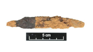 Photo 2: iron object, possibly a blade and tang