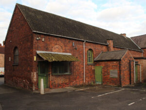 Photo 1: view looking towards the western wing of the former stables within the curtilage of the Grade II listed town hall