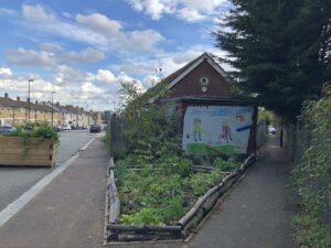 Photo 2 Looking SE showing rear of site and Brockley footpath